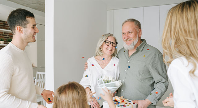 elderly couple with their family