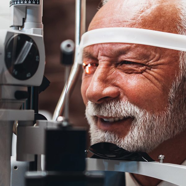 Elderly man having an eye exam for Glaucoma diagnosis