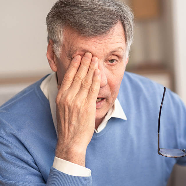 Glaucoma. Tired Elderly Man Massaging Eye Holding Eyeglasses Hav
