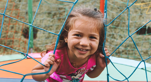 Girl with myopia playing outside