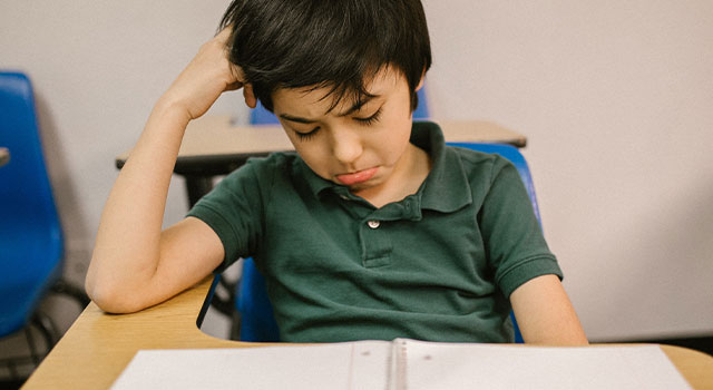 child in school unable to work due to myopia