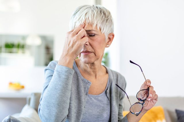Senior woman struggling with eye pain 640x427