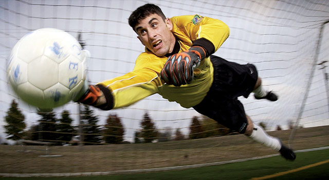 Goalkeeper blocking a goal