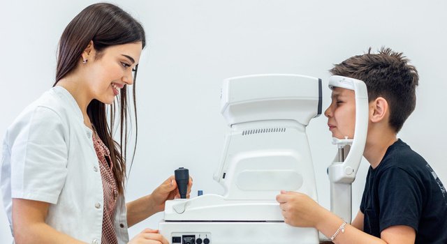 boy undergoes eye exam