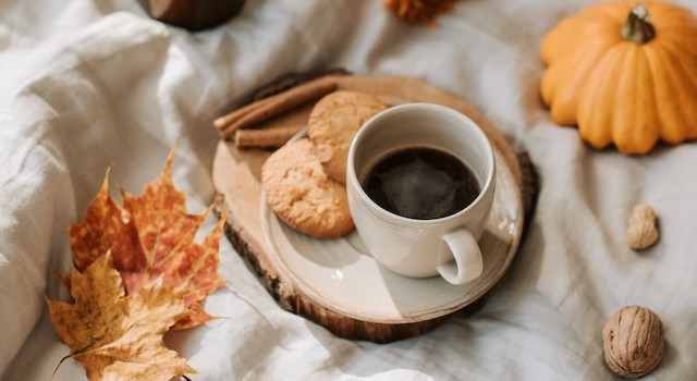 cup of coffee and autumn leaves