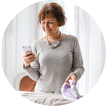happy senior woman using smartphone